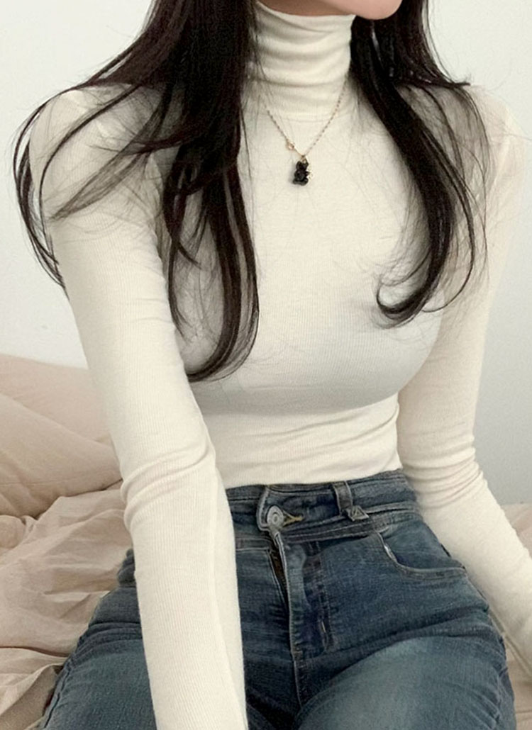 tight white sweater