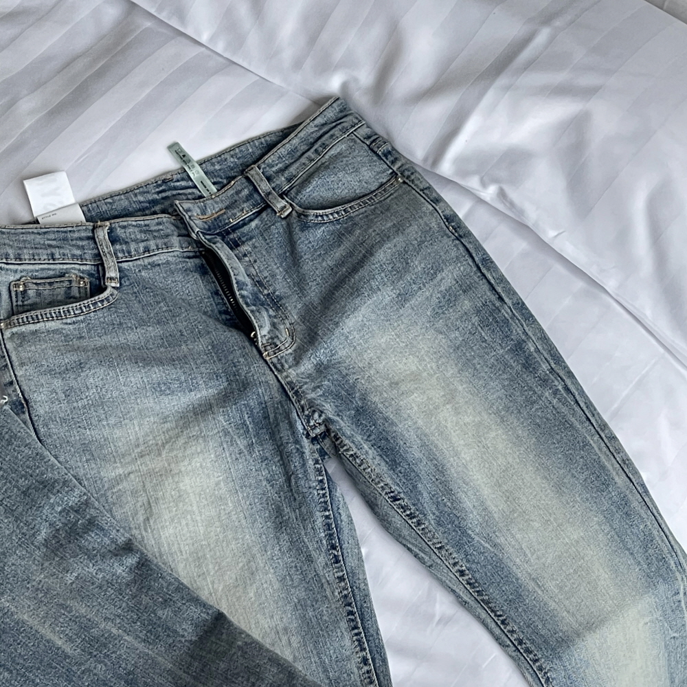 ウォッシングカットブーツカットライトブルーデニムパンツ